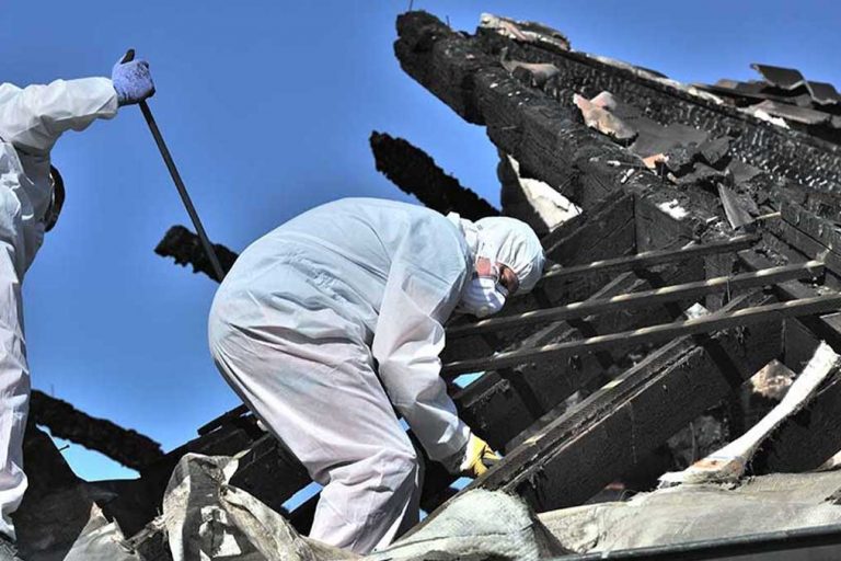 Restoration experts cleaning up after fire damage